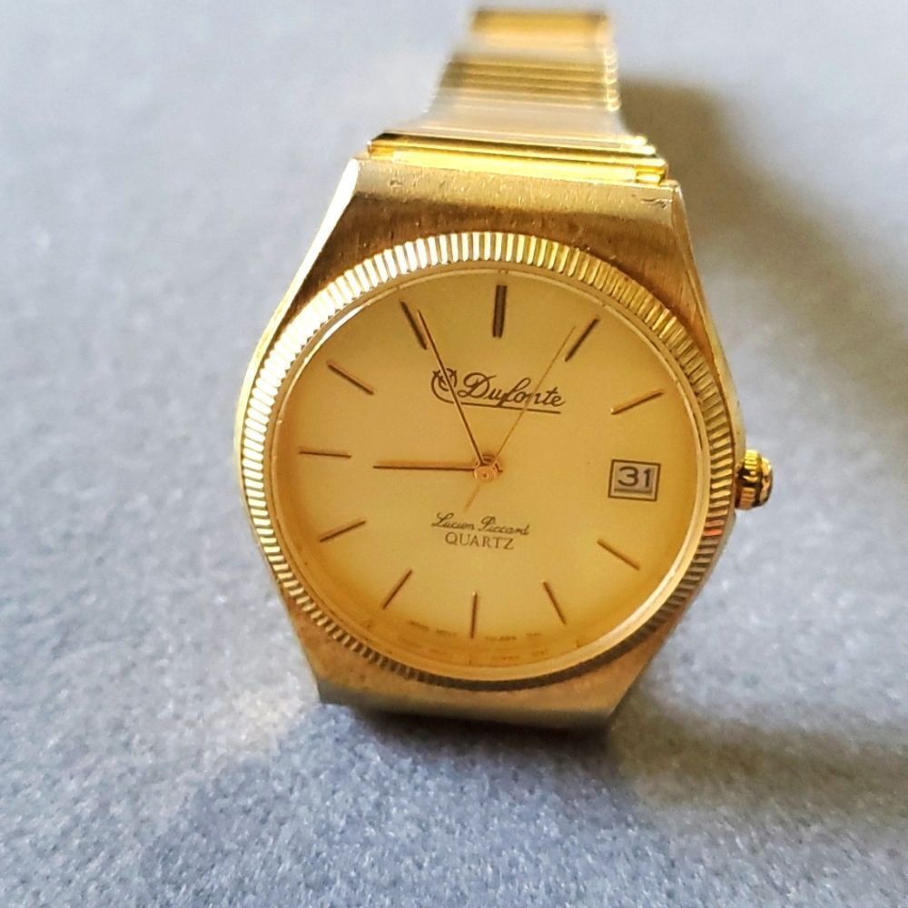 Mens quartz watch‎ by Dufonte lucien piccard.. gold tone stretch band.